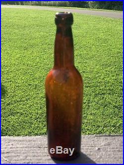 1861-3 Arnold & Co Beer bottle Ogdensburg, NY Amber