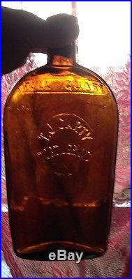 Amber T. J. Carty Port Jervis New York Embossed Slug Plate Strap Flask
