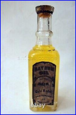 Antique BAY RUM OIL BOTTLE w CONTENTS gold medal perfumery co ny BARBER HAIR