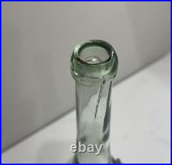 C1890s Lorenz Reich New York, N. Y. Aqua Blown Glass Applied Lip Wine Bottle