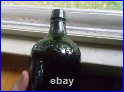 Clarke & Co New York Curved Shoulder Emb 1860 Blackglass Mineral Water Bottle
