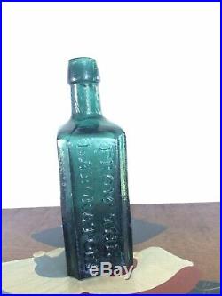 G. W. Merchant, Lockport N. Y. Lockport Tale Green Medicine Bottle