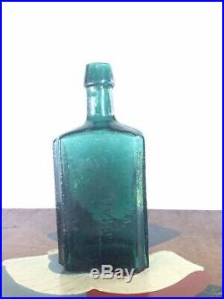 G. W. Merchant, Lockport N. Y. Lockport Tale Green Medicine Bottle