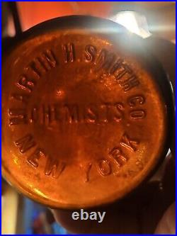 Large Embossed Martin H. Smith Co. Chemists New York Empty Amber Bottle