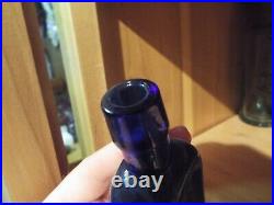 Merchant's Gargling Oil Lockport NY cobalt blue bottle with label 41% alcohol