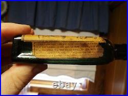 Merchant's Gargling Oil Lockport NY green medicine bottle with label 41% alcohol